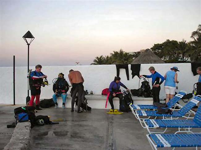 Divers getting ready to make a night dive - Photo by Greg O